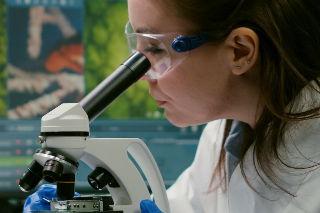 Portrait of biologist scientist in white coat working in expertise laboratory